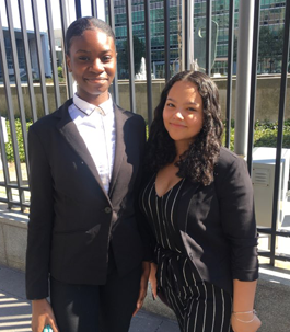 two girls dressed in business suits