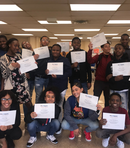 students holding certificates