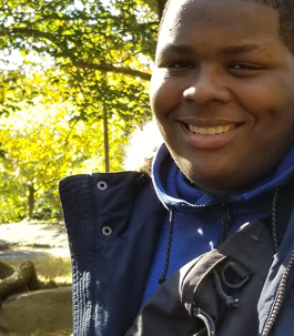 a smiling male student