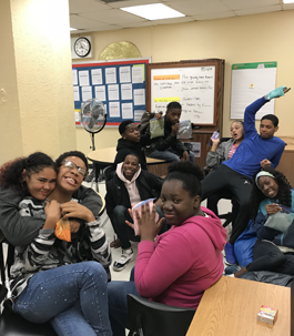 smiling students sitting together in the classroom
