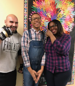 three smiling students