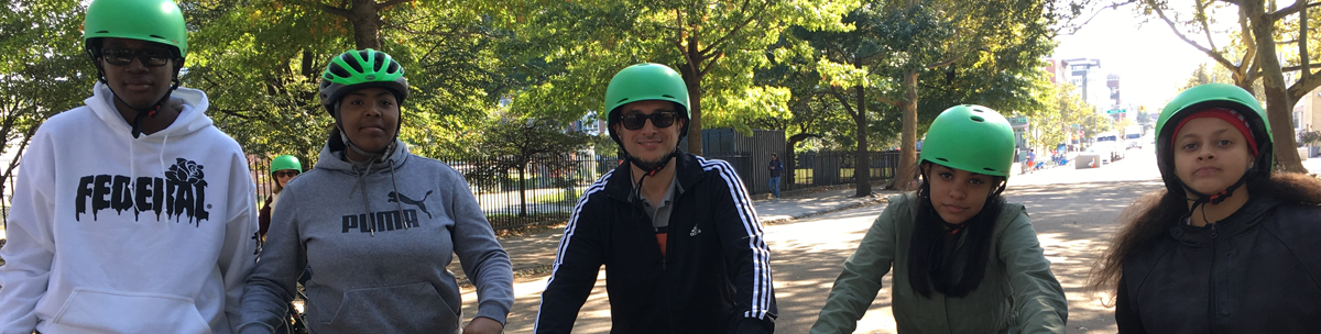 students with bicycles in the park